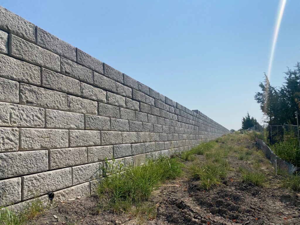 Stone-textured precast concrete panel wall installed by Dayd Masonry in Dallas, TX